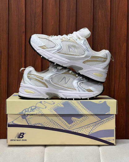 NEW BALANCE 530 BLANCO DORADO